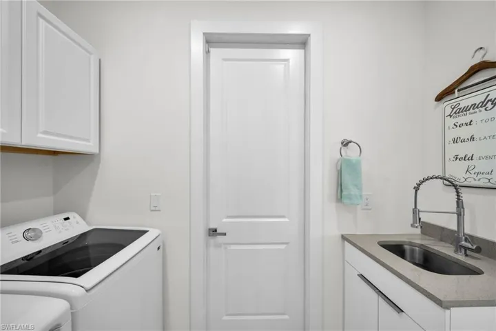 Laundry room with cabinet space and washing machine and dryer