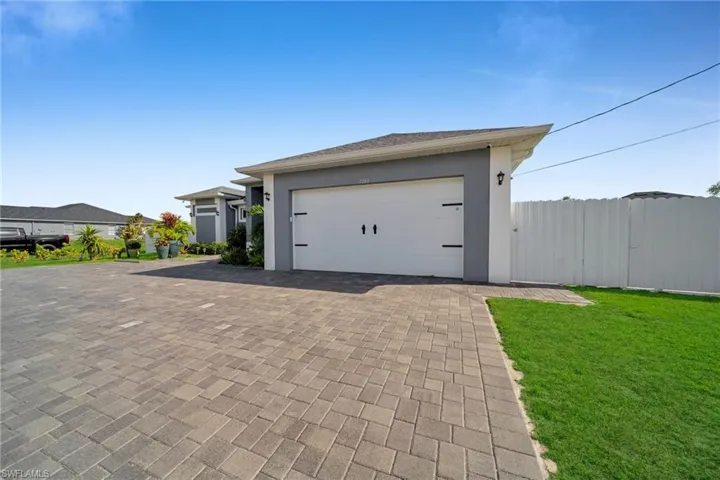 Garage with decorative driveway