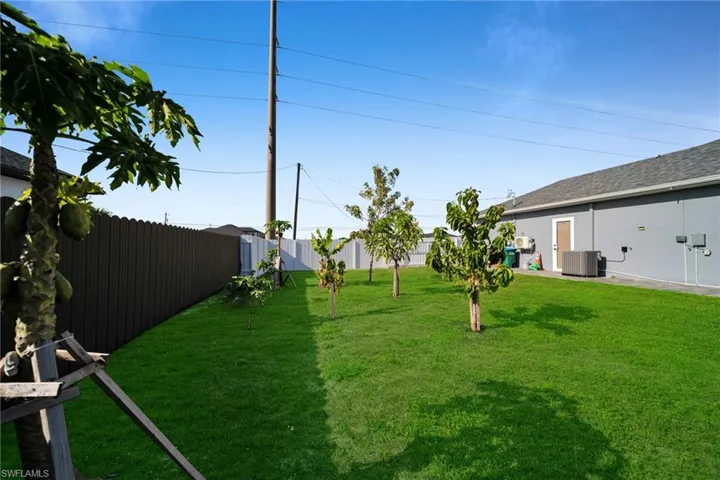 Fenced backyard featuring a patio