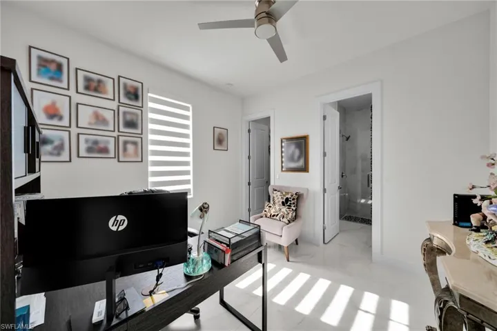 Office area with a ceiling fan