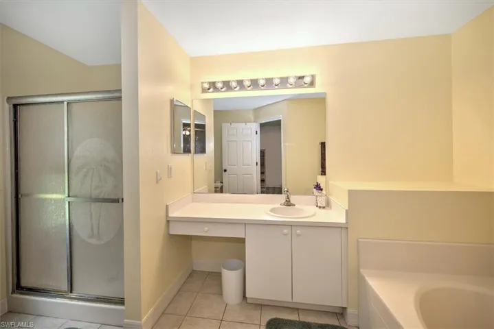 Master bathroom with a separate shower and garden tub.