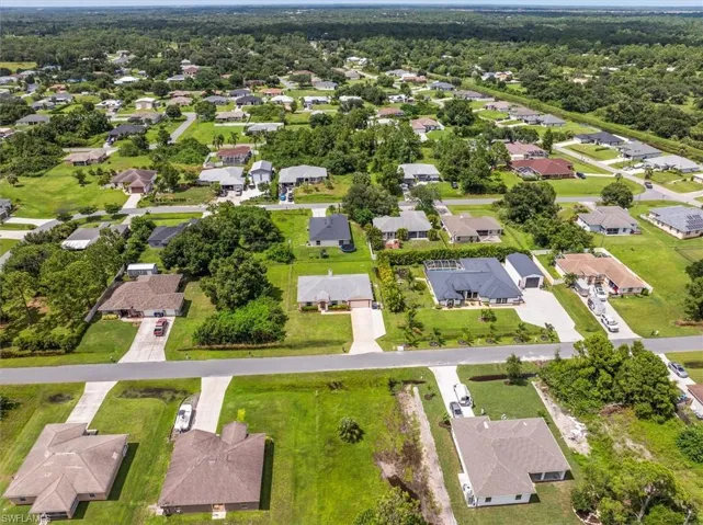 Drone view, the home is in the center of the photo with the extra lot available on the right