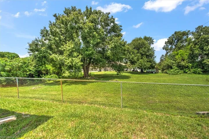 Extra lot next door is available to purchase by this owner.