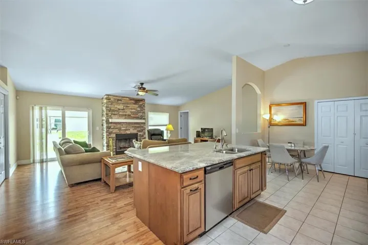 Kitchen has been updated with wood cabinets and granite counter tops.
