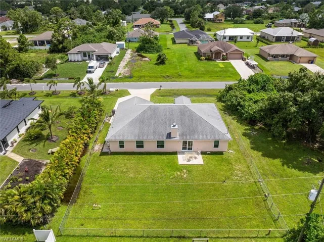 Closer drone view of the backyard.