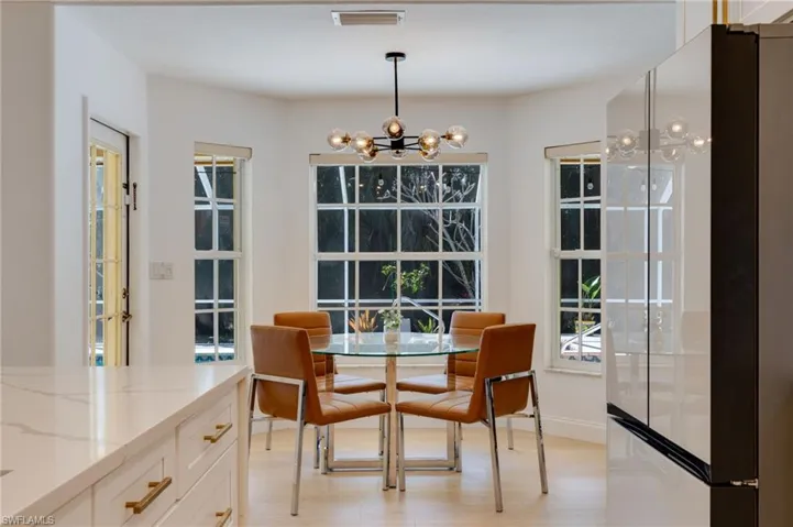 Dining space featuring a chandelier and light wood-type flooring