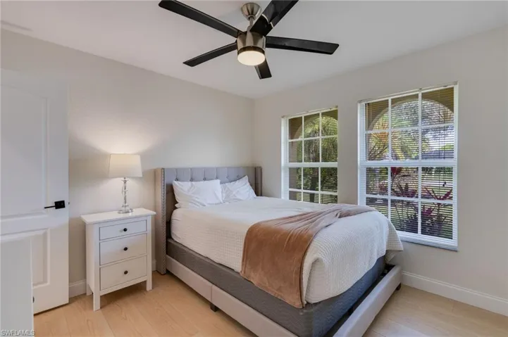 Bedroom featuring light wood-type flooring and a ceiling fan