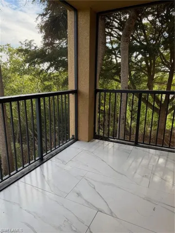 Balcony featuring a sunroom