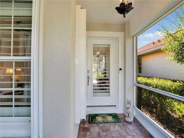 Property entrance with a balcony
