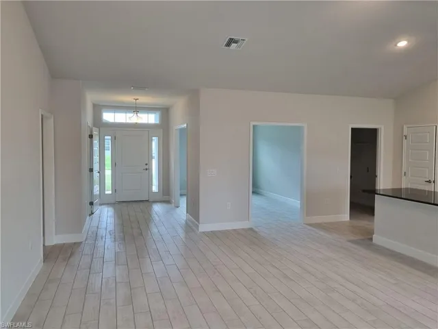Entrance foyer with light wood-type flooring