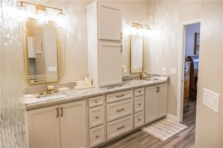Bathroom with vanity and wood-type flooring