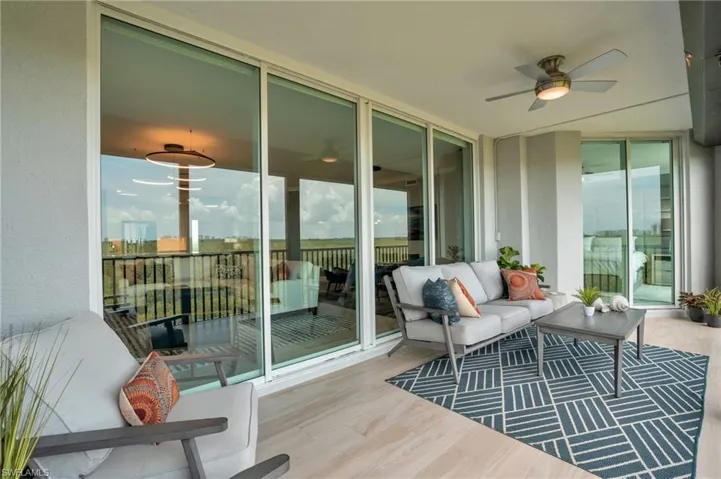 Furnished lanai with electric storm shutters