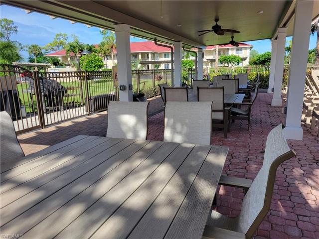 Andover covered seating area adjoining the pool