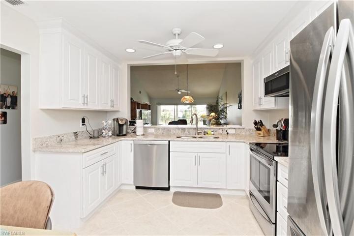 Recessed can lighting offers plenty of light. Tile floor recently cleaned, regrouted and professionally sealed.