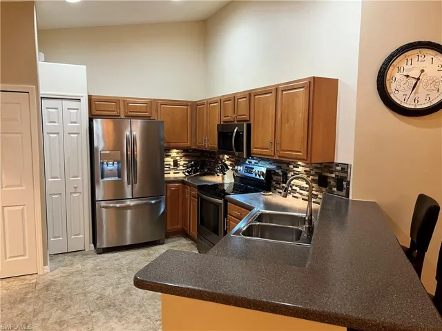 Spacious and Bright Kitchen with vaulted ceiling open to the Living/Dining Room.