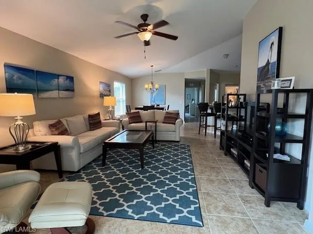 Perfect floor plan for entertaining in your Spacious Great Room featuring tile floor and volume ceiling.