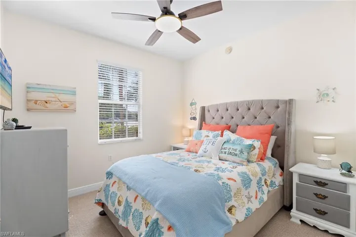 Bedroom with light carpet and ceiling fan