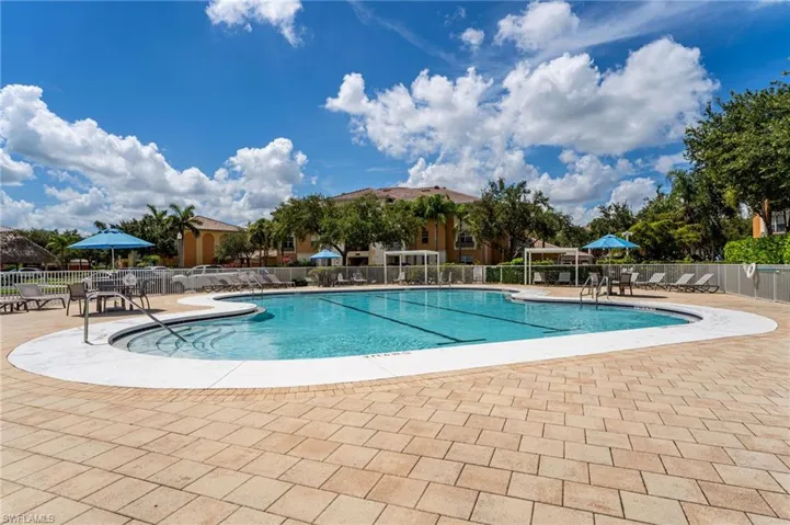 Community pool with a patio area