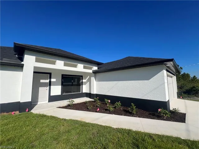 Property entrance with stucco siding