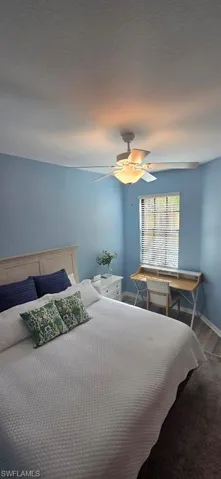 Bedroom featuring ceiling fan and wood finished floors