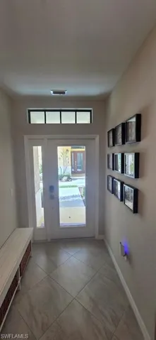 Foyer entrance featuring baseboards