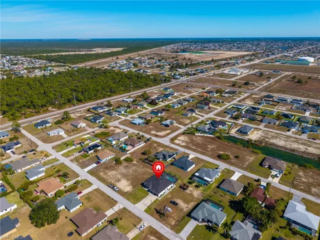 View of property location with nearby suburban area