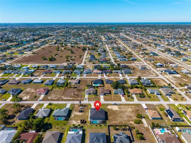 View of property location with nearby suburban area