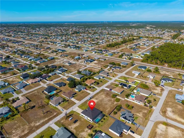 View of property location with nearby suburban area