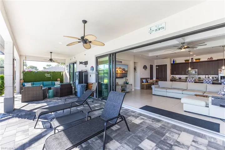 View of patio / terrace with an outdoor living space and ceiling fan