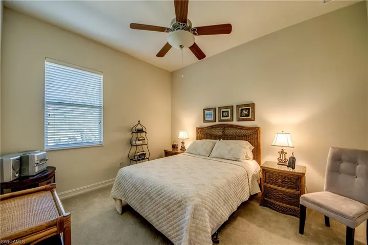 Bedroom with carpet and ceiling fan