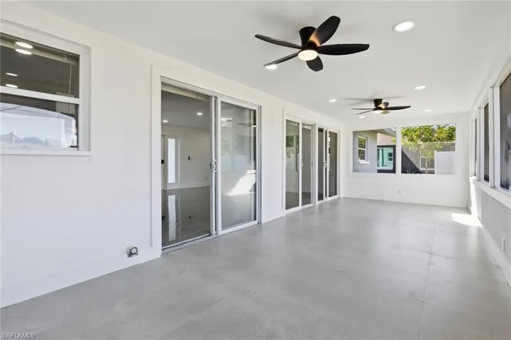 Unfurnished sunroom featuring recessed lighting