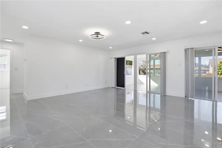 Spare room featuring recessed lighting and baseboards