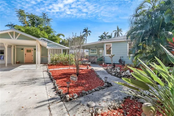 View of front of property with a carport