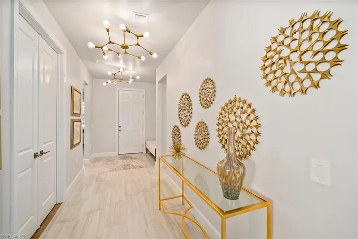 Foyer entrance featuring a chandelier