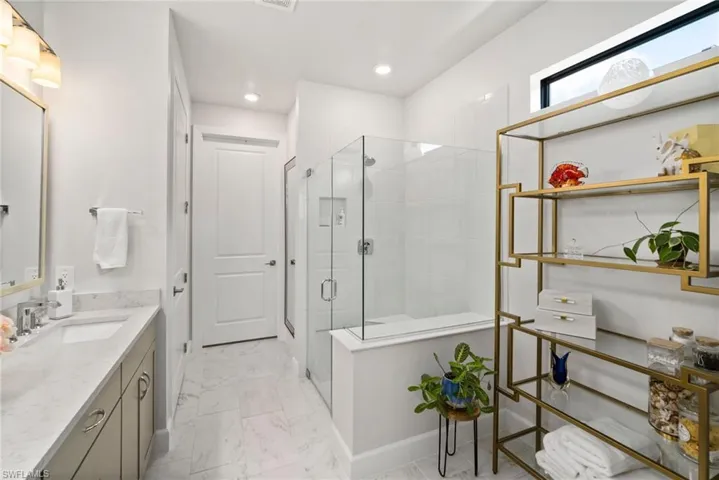 Bathroom with an enclosed shower and vanity