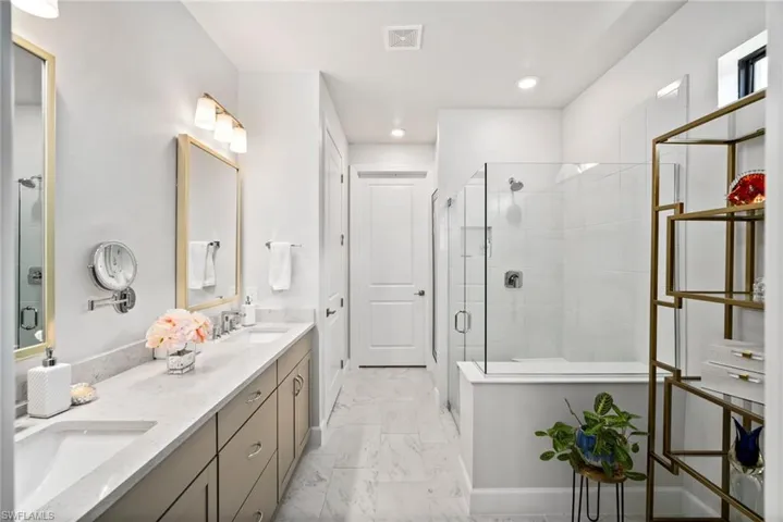 Bathroom with vanity and walk in shower