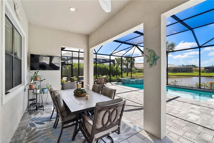 View of patio / terrace with a water view and a lanai