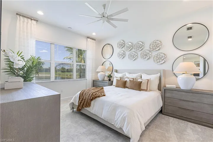 Carpeted bedroom with ceiling fan