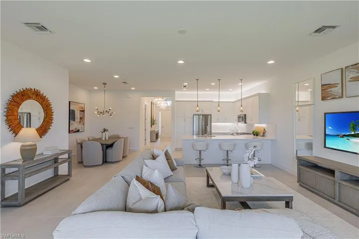 Tiled living room with an inviting chandelier