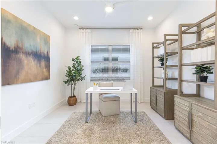 Office space featuring light tile flooring