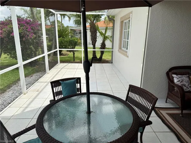 Sunroom / solarium featuring outdoor dining area