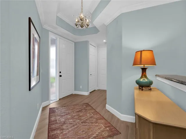 Entrance from the front door and two car garage with coat closet on the left and a bonus room on the right.