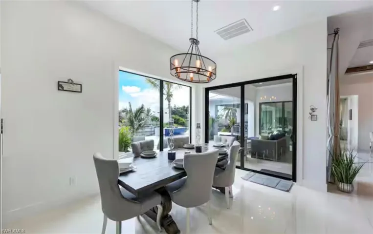 Dining area featuring suspended lighting