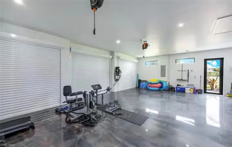 Exercise room featuring recessed lighting