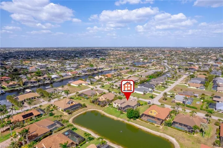 Drone / aerial view with a residential view and a water view