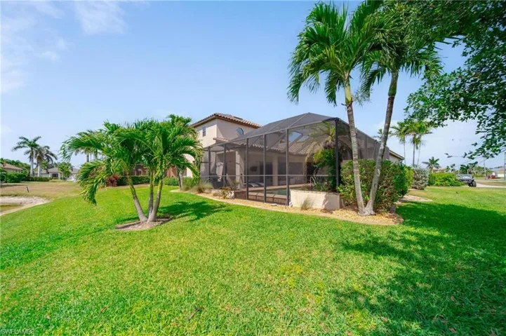 View of yard with a lanai