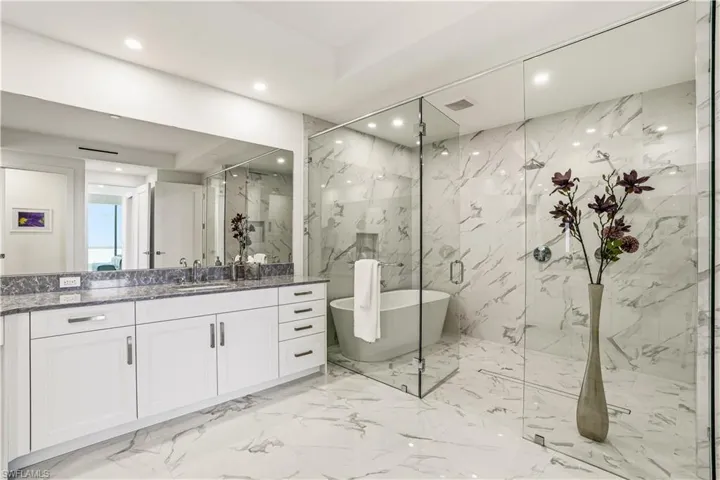 Indulge in ultimate relaxation with a spaciouswalk-in shower, dual showerheads, and aninviting soaking tub
