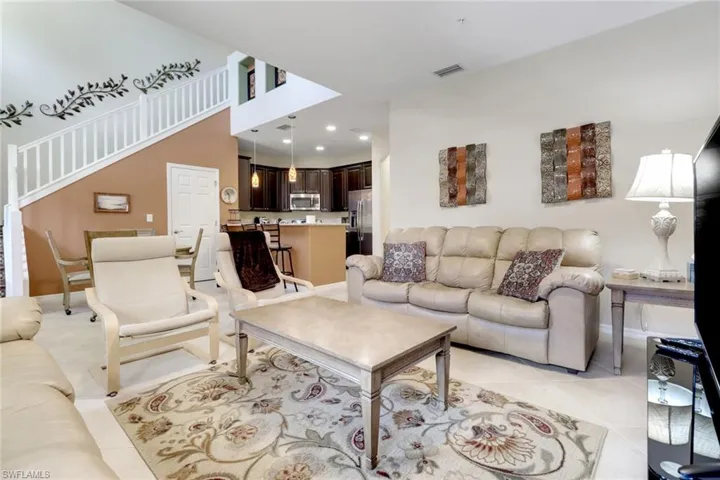 Living area with baseboards, recessed lighting, and light tile patterned floors