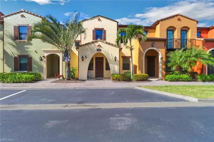 Mediterranean / spanish-style house with a tiled roof, stucco siding, and a balcony