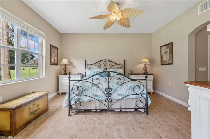 Bedroom with ceiling fan and light hardwood / wood-style flooring